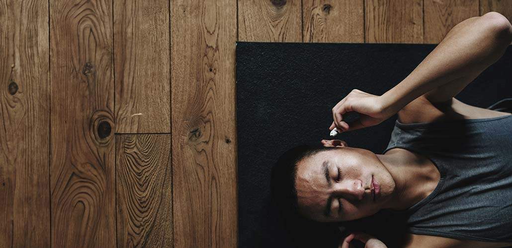 Man laying down for a progressive muscle relaxation technique